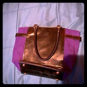Mid size purple and black purse.